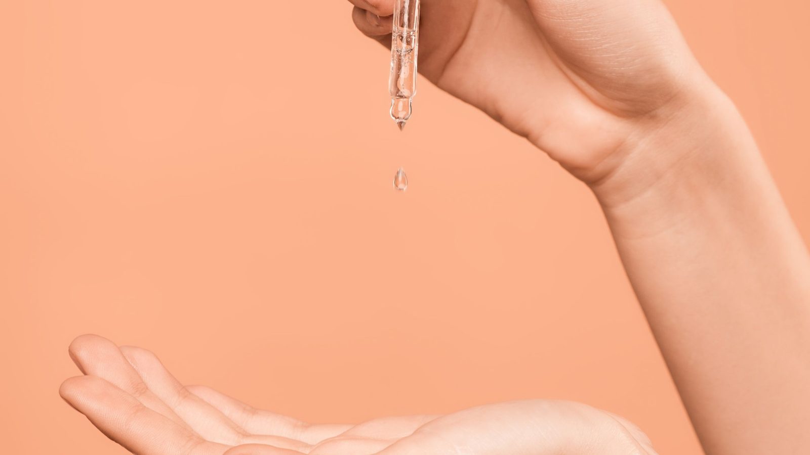 Product in use: a close-up of serum drops on a hand
