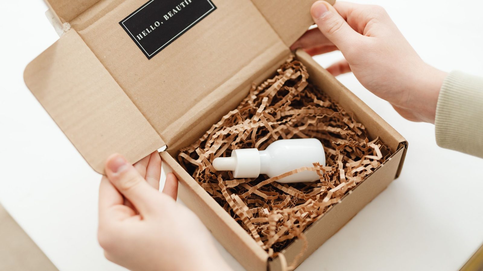 Unboxing a product package on a creator's desk