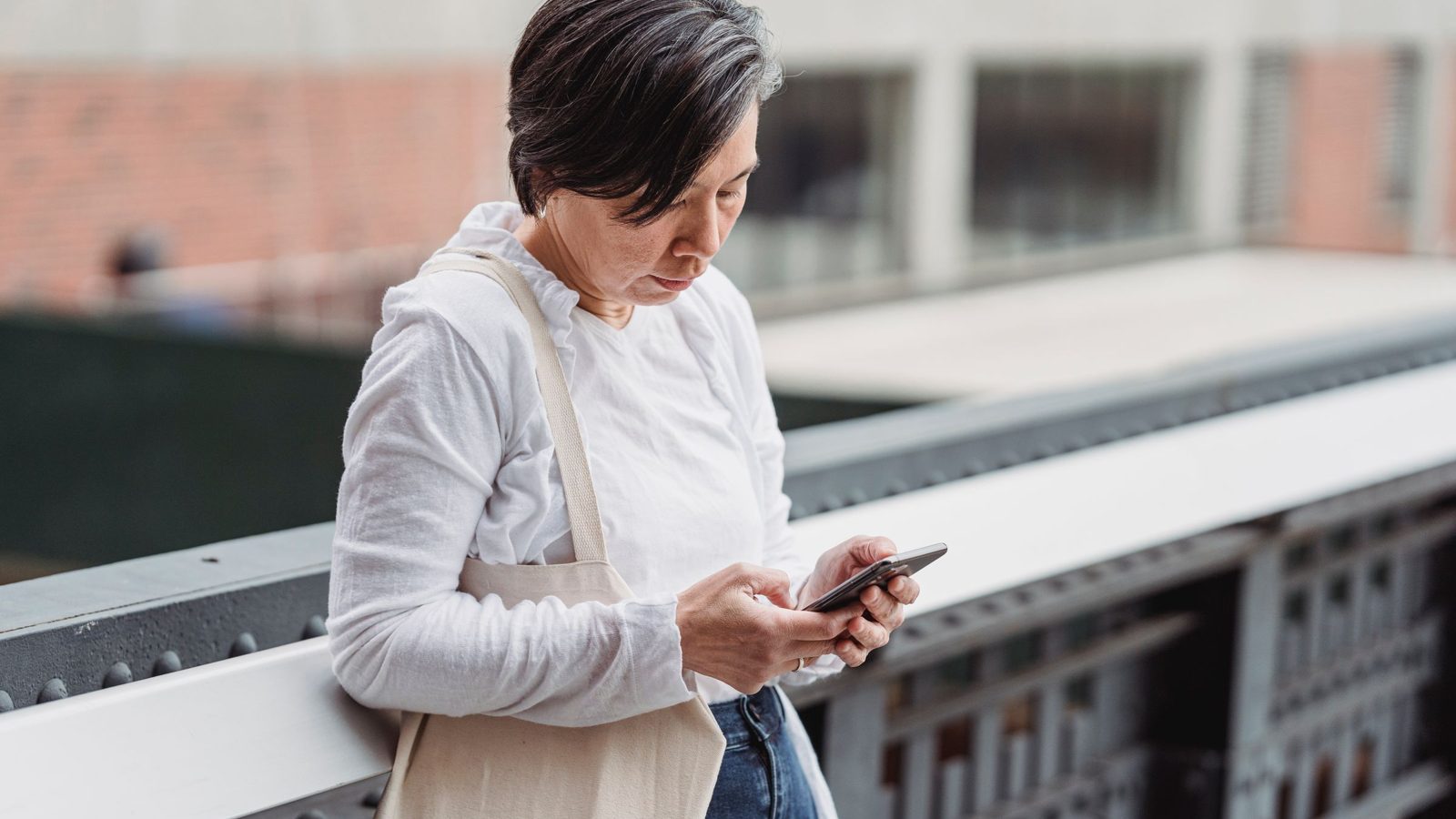 A woman watching a product video on her phone